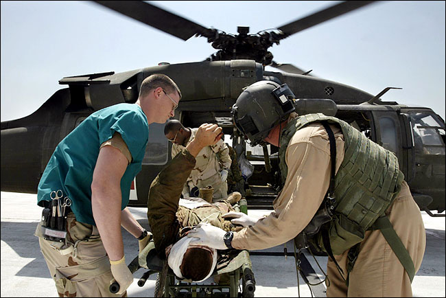 An American marine wounded in fighting in Najaf was unloaded from a helicopter of the Army's 45th Medical Company in Baghdad, August 06, 2004.